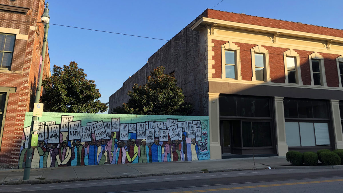 View of the mural "I Am A Man" by Marcellous Lovelace (installed by BLK75) on South Main Street, Memphis, Tennessee, under the waning light. (Photo by Ben Young Landis)