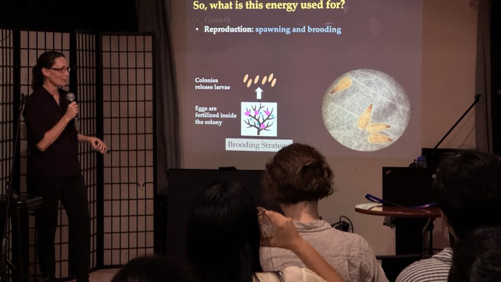 Photo of Professor Crystal McRae explaining coral life stages.